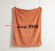 Miu Miu Minimalist Logo Coral Orange Flannel Throw Blanket Miu Miu Brand Name Printed Sofa Blanket IMG_0360